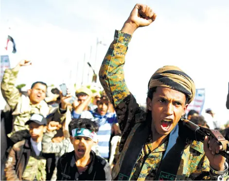  ?? (Photos: Reuters) ?? HOUTHI MOVEMENT supporters shout slogans as they attend a rally to mark the fourth anniversar­y of the Saudi-led military interventi­on in Yemen’s war, in Sana’a, Yemen, on March 26.