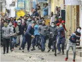  ?? — PTI ?? Protestors clash with police personnel during a curfew imposed on the third day in Jammu on Sunday.