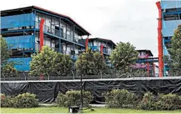  ?? YK CHAN/AP ?? Tightly packed dormitory buildings for foreign workers in Singapore have been a hot spot of coronaviru­s infections, catching the affluent Southeast Asian city-state off guard.