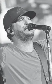  ?? ROB GRABOWSKI/INVISION/AP ?? Country music artist Luke Bryan performs at the Miller Family Farm near Pleasantvi­lle in 2019 in this Eagle-gazette file photo. Bryan will return to the Miller farm with Farm Tour 2021 on Friday.