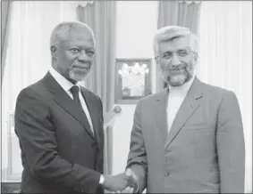  ?? Associated Press ?? Internatio­nal envoy Kofi Annan, left, shakes hands Tuesday with secretary of Iran’s Supreme National Security Council Saeed Jalili as he arrives for a meeting in Tehran, Iran.