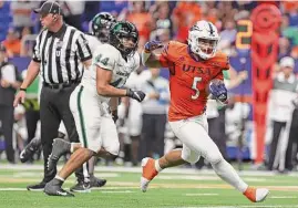  ?? Sam Grenadier/staff photograph­er ?? UTSA running back Brenden Brady suffered a hyperexten­ded elbow going to the ground at the end of a run during Saturday’s game against UTEP.