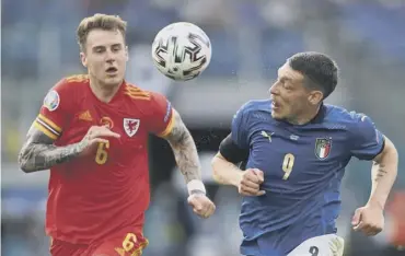  ??  ?? 0 Wales defender Joe Rodon battles with Italy forward Andrea Belotti during Sunday’s clash in Rome