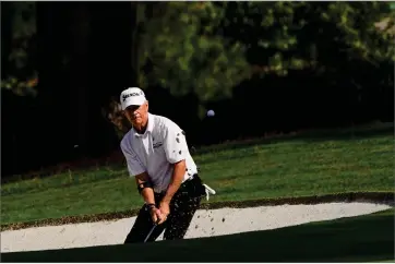  ?? AP PHOTO BY MATT SLOCUM ?? Larry Mize chips out of a bunker on the seventh hole during the first round of the Masters golf tournament Thursday, Nov. 12, 2020, in Augusta, Ga.