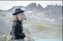  ?? AFP ?? A woman takes part in a ceremony to mark the 'death' of the Pizol glacier above Mels, eastern Switzerlan­d.