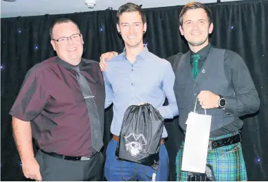  ??  ?? MVP Neil Baptie, centre, collects his prize from head coach Jamie McLaughlin, right, and OnPoint Financial’s Steven Downie