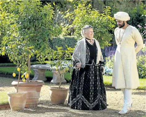  ?? PETER MOUNTAIN/FOCUS FEATURES VIA AP ?? Judi Dench, left, and Ali Fazal appear in a scene from Victoria and Abdul.