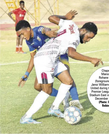  ?? (Photo: Garfield Robinson) ?? Chapelton Maroons’s
Rohane Brown (foreground) gets by Janoi Williams of Molynes United during their Jamaica Premier League contest at Stadium East on Wednesday, December 21, 2022.