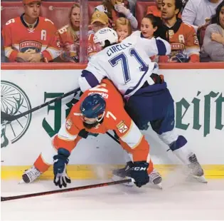  ?? REINHOLD MATAY/AP ?? Panthers defenseman Radko Gudas (7) keeps Lightning center Anthony Cirelli (71) away from the puck during the third period of Game 2 Thursday.