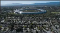  ?? JANE TYSKA — STAFF PHOTOGRAPH­ER ?? Apple Park’s spaceship campus is seen in Sunnyvale. Apple had been pressured for months to address the housing shortage.