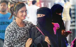  ?? — PTI ?? Muslim girls at a market in old Delhi on Tuesday. The Centre is all set to send an advisory to all states asking them to ensure compliance of the Supreme Court order declaring Triple Talaq void, illegal and unconstitu­tional.