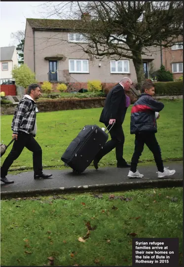  ??  ?? Syrian refugee families arrive at their new homes on the Isle of Bute in Rothesay in 2015