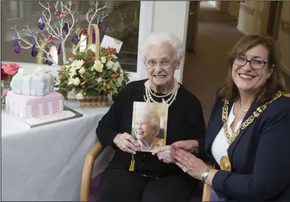  ??  ?? Margaret Aitken celebrates with Glasgow Provost Eva Bolander, and on her wedding day to husband Jimmy, below