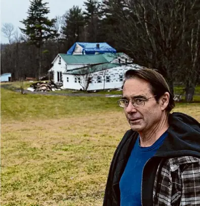  ?? Will Waldron/times Union ?? Joe Polizzi stands on his former Schoharie County property that was seized after he said he could no longer afford to pay the property taxes. Polizzi, of Carlisle, says he could recoup over $100,000 if a suit filed against the county for keeping the excess profits from the sale goes through. At top, this Johnstown house at 459 Route 334, is one of the foreclosed properties included in a lawsuit filed against Fulton County that cites excessive fines.