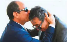  ?? Courtesy: Twitter ?? Abdul Fattah Al Sissi (left) officially feted Col Sa’atae Al Nouamani at a televised police ceremony in Cairo in 2015, kissing his head in a gesture of esteem. Giza authoritie­s also named a school in the pyramid-famous city after him.