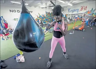  ?? AP PHOTO ?? Torya Whittaker works out at Legacy Fit in the Wynwood Art District of Miami. As the vast majority of inperson fitness clubs switched to virtual classes when the pandemic hit, Legacy Fit took the opposite approach.