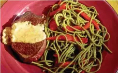  ?? LINDA GASSENHEIM­ER/TRIBUNE NEWS SERVICE ?? Beef Tenderloin Gorgonzola With Spaghetti and Sweet Pimentos.