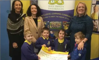  ?? ?? Pictured are Geraldine Corrigan, Martina Cox (Friends of the Cancer Centre), Una Williams, teacher in Holy Trinity, and some of the children from the school’s Nurture Room.