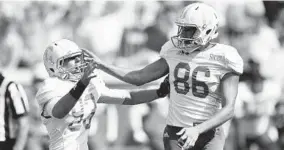  ?? MIKE STEWART/AP ?? The Citadel kicker Jacob Godek, right, celebrates hitting the game-winning field goal.