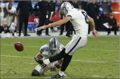  ?? Ross D. Franklin ?? The Raiders’ Daniel Carlson kicks the winning field goal against the Arizona Cardinals on Sunday.The Associated Press