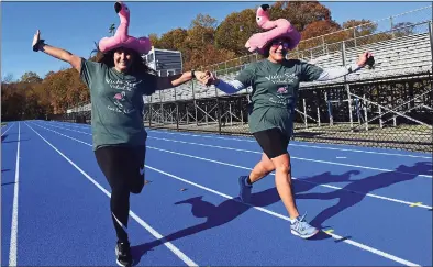  ?? Erik Trautmann / Hearst Connecticu­t Media ?? Bunnell High School faculty including counselor Amanda Cotella and principal Nancy Dowling and their families run in the mini Vicki Soto 5K Saturday.