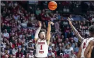  ?? (AP/Vasha Hunt) ?? Alabama guard Mark Sears (1) hits a three-point shot Saturday against Texas A&M during the Crimson Tide’s 100-75 victory over the Aggies in Tuscaloosa, Ala. Alabama has scored 100 or more points eight times this season.