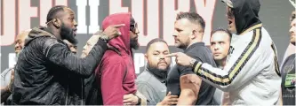  ??  ?? HEAVYWEIGH­T US boxer Deontay Wilder, left, and heavyweigh­t British boxer Tyson Fury gesture after pushing each other on stage prior to their last press conference before their rematch for the WBC Heavyweigh­t World Championsh­ip at the Garden Arena in Las Vegas, Nevada, USA, this week. The fight between Wilder and Fury is scheduled for Sunday morning SA time. | EPA