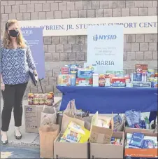  ?? Provided ?? New York State Industries for the Disabled volunteers organized a food drive for Maria College, which serves many economical­ly disadvanta­ged students studying for health care careers. Food insecurity is a huge problem for many students.