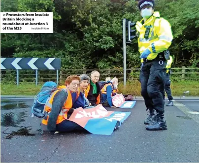  ?? Insulate Britain ?? > Protesters from Insulate Britain blocking a roundabout at Junction 3 of the M25