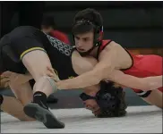  ?? KEN SWART — MEDIANEWS GROUP, FILE ?? High school wrestling is a winter contact sport that does not require their athletes to wear masks while competing due to their athletes participat­ing in a rapid antigen testing program.