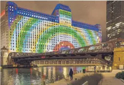  ??  ?? Art on the Mart, a digital art installati­on, projects across a 2.5-acre building facade facing the Chicago River.