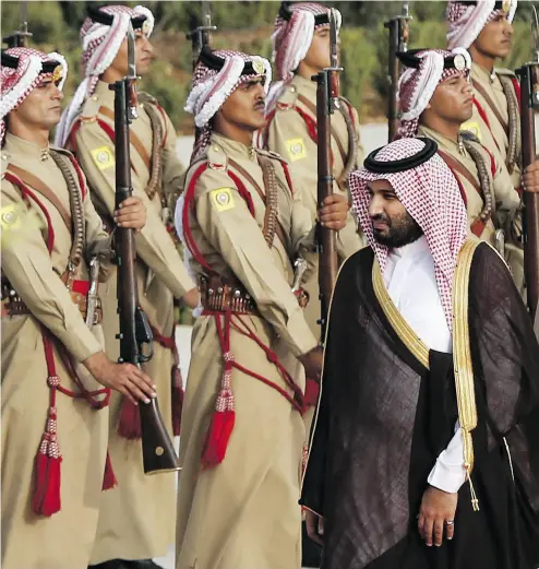  ?? MUHAMMAD HAMED - POOL /GETTY IMAGES FILES ?? Saudi Arabia’s Deputy Crown Prince Mohammed bin Salman reviews Bedouin honour guards on his arrival to meet Jordan’s King Abdullah at the Royal Palace in Amman earlier this year.