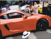  ?? YouTube ?? A PORSCHE DRIVER blocked from making an illegal U-turn got out to mock the other driver’s car and clothes. The fight got physical, and went viral.