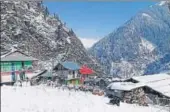  ?? HT PHOTO ?? A blanket of snow envelops Kullu’s Malana village as parts of Himachal Pradesh witness fresh snowfall on Thursday.