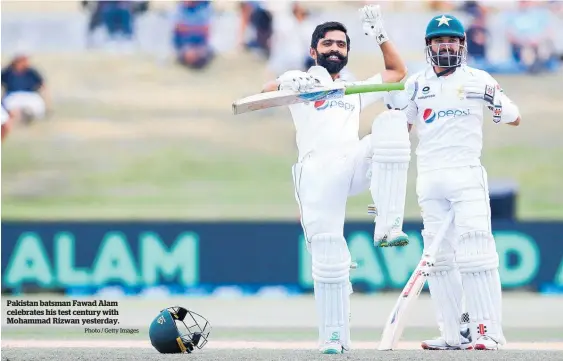  ?? Photo / Getty Images ?? Pakistan batsman Fawad Alam celebrates his test century with Mohammad Rizwan yesterday.