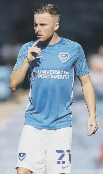  ??  ?? FOR CLUB AND COUNTRY Pompey’s Joe Morrell says he can still play internatio­nal football despite playing in League One