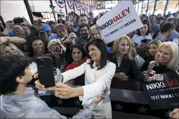  ?? MIC SMITH — THE ASSOCIATED PRESS ?? Republican presidenti­al candidate Nikki Haley greets supporters after her speech Wednesday in Charleston, S.C.