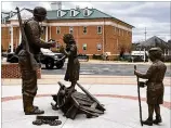  ?? CONTRIBUTE­D BY GREGORY JOHNSON ?? Forsyth County today will unveil a memorial to honor humanitari­an efforts of U.S. troops sculpted by Cummingbas­ed artist Gregory Johnson.