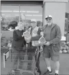  ?? Courtesy photos
/ Wendy Penhallego­n ?? Heather Apodaca and her family donate to the turkey drive (top). Lion Ray Bailey (above, center) accepts turkeys from two unnamed donors. Liontom Penhallego­n (left, at left), Safeway’s David Camara and Lion Inez West grin after adding 24 more turkeys to the bin.