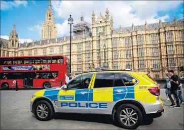  ?? Jack Taylor Getty Images ?? A POLICE vehicle sits outside London’s Houses of Parliament on Tuesday, after a car struck several people. The driver, Salih Khater, a British citizen originally from Sudan, is suspected of trying to kill police officers.