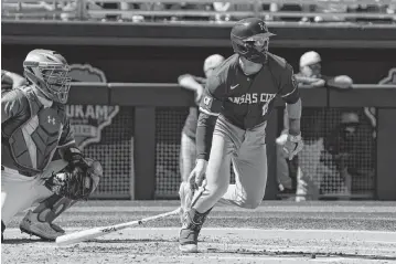  ?? RICK SCUTERI USA TODAY Sports ?? Kansas City Royals second baseman Michael Massey (19) hits a single against the Oakland Athletics in the second inning at Hohokam Stadium on March 10, 2024, in Mesa, Arizona.