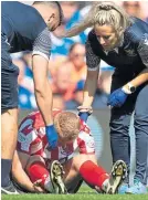  ?? ?? Cammy Macpherson suffers his injury at Ibrox.