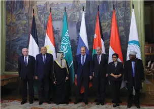  ?? (Evgenia Novozhenin­a/Pool/Reuters) ?? RUSSIAN FOREIGN MINISTER Sergei Lavrov poses for a group photo with foreign ministers from members of the Arab League and the Organizati­on of Islamic Cooperatio­n, in November.