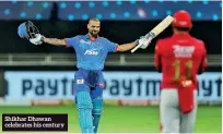  ??  ?? Shikhar Dhawan celebrates his century