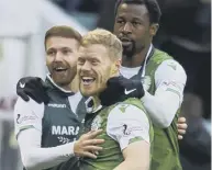  ??  ?? 2 Martin Boyle, left, Daryl Horgan and Efe Ambrose celebrate Hibs’ early opening goal against Dundee.