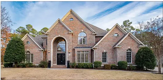  ?? SUBMITTED PHOTOS ?? This five-bedroom, five-full-and-two-half-bath, two-story home in Little Rock has a stunning kitchen, a functional laundry room and spacious bedrooms.