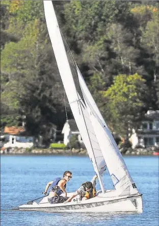  ?? Hearst Connecticu­t Media file photo ?? Members of the Wesleyan Sailing Team practice on Lake Pocotopaug in East Hampton. For years the lake has been plagued by toxic algae blooms.