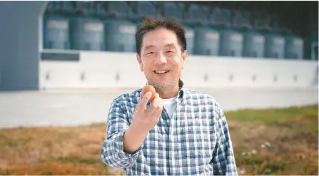  ?? Courtesy of GanongBio ?? Yoo Jai-gug, president of GanongBio, holds one of the eggs produced at Ganong Farmillion Valley in Pocheon, Gyeonggi Province.