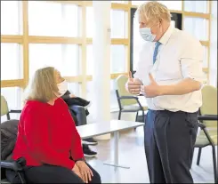  ?? Pictures: Andrew Parsons / No 10 Downing Street ?? Boris Johnson chats to a woman in the waiting area of the oncology centre