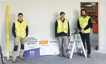  ?? ?? Metricon service trades employees Luke Ingram and Brett Lang with Metricon Gippsland Service and Warranty Manager Josh Tree in amongst constructi­on work at Olivia Place’s new home in Drouin.